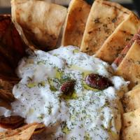 Euro Tzatziki Sauce · Creamy yogurt and cucumber dip served with our homemade baked pita chips.
