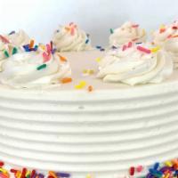 8 Inch Confetti Vanilla Cake · Vanilla cake with strawberry filling topped with buttercream frosting and sprinkles.