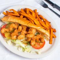 Shrimp Po-Boy · Fried shrimp, lettuce, tomato, pickle, tabasco remoulade on buttered French bread.