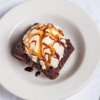 Chocolate Brownie Sundae · Served with vanilla ice cream caramel and chocolate sauce.