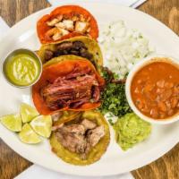 Street Tacos (Pork, Brisket, Chicken, Asada) · *BAJA FAVORITE* 
FOUR Baja style street tacos on our house made nopales (cactus) and guajill...