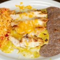 Picante Enchiladas · Two soft cheese tacos topped with spicy queso sauce, grilled chicken. Served with Mexican ri...