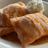 Sopapillas · This iconic fried pastry is served drizzled with honey and served with a dipping sauce you'r...