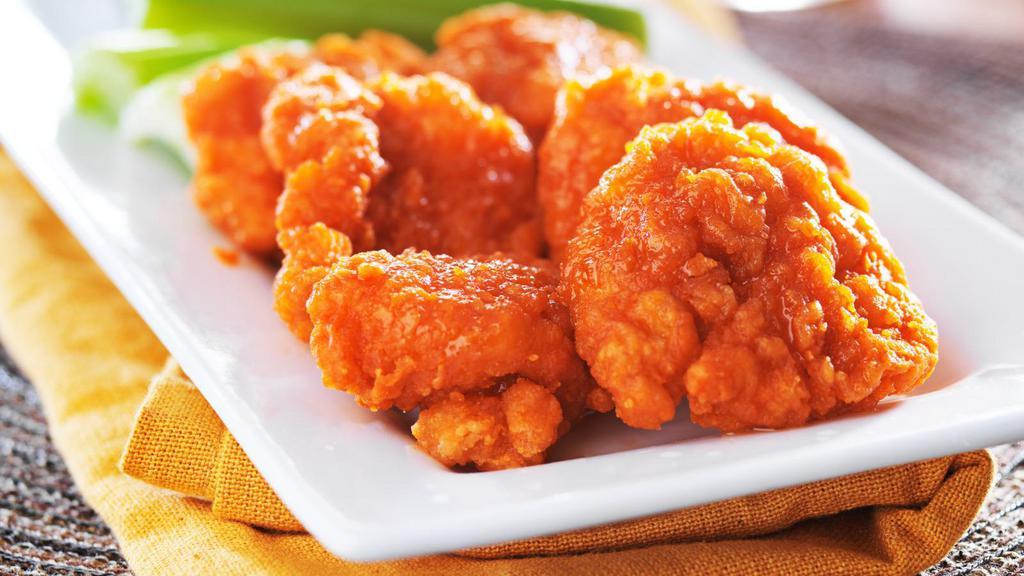 Buffalo Wings (Boneless) · Crispy, golden fried boneless wings seasoned to perfection and tossed with classic, spicy and vinegar Buffalo sauce.