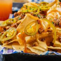 Nachos · Smoked brisket or pulled pork, melted cheese, barbecue sauce and jalapenos.