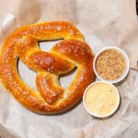 Beer Pretzel · Served with queso and spicy mustard.