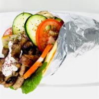 Gyro In Pita · Finely ground lamb & beef meat, seasoned with Mediterranean spices, grilled by order for max...