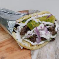 Kofta In Pita · Ground lamb & beef seasoned with our house mixture of Mediterranean spices. Grilled by order...