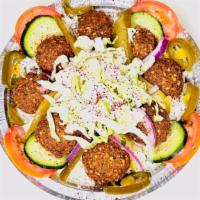 Falafel Bowl · Served over Rice, over Hummus, or both, with fresh lettuce, pickles, tomato, cucumber, red o...