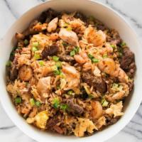 Supreme Fried Rice · Steak, chicken & shrimp stir-fried with our signature fried rice recipe with carrots, green ...
