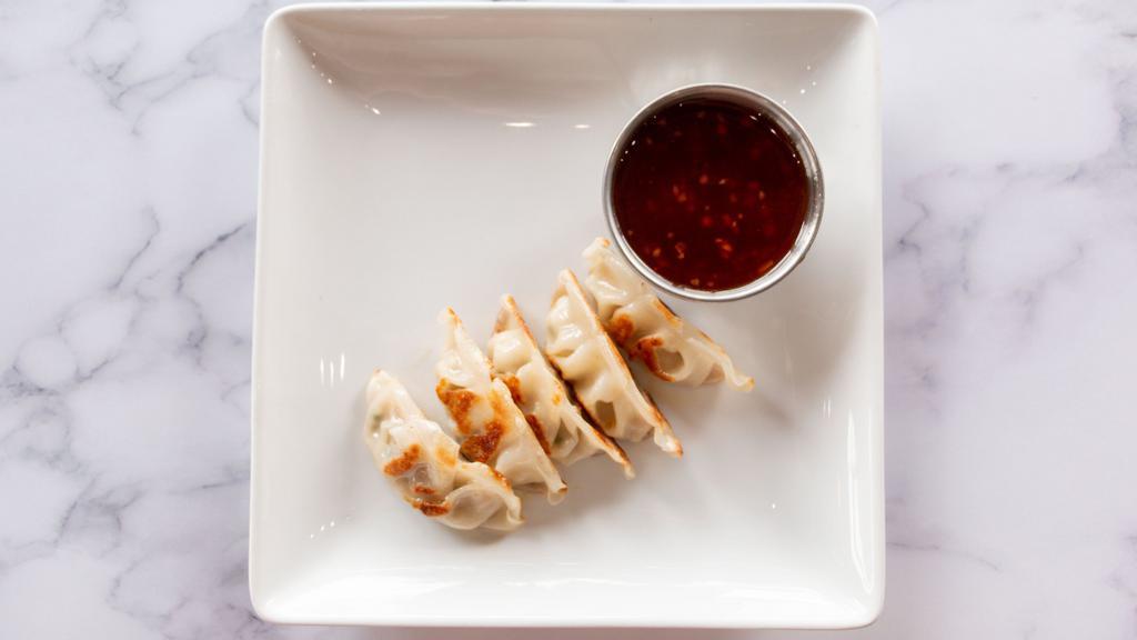 Pork Potstickers · Pan-seared wonton wrapper stuffed with marinated pork and served with sweet Thai Chili sauce.