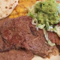 Steak Cozumel · Garcia's specialty. Eight oz rib-eye steak served with cheese, chicken, or beef enchilada an...