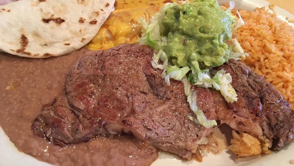 Steak Cozumel · Garcia's specialty. Eight oz rib-eye steak served with cheese, chicken, or beef enchilada and guacamole.