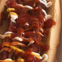 Hotdog · 100% All- Beef Hot Dog served with freshly caramelized onions and an assortment of toppings.