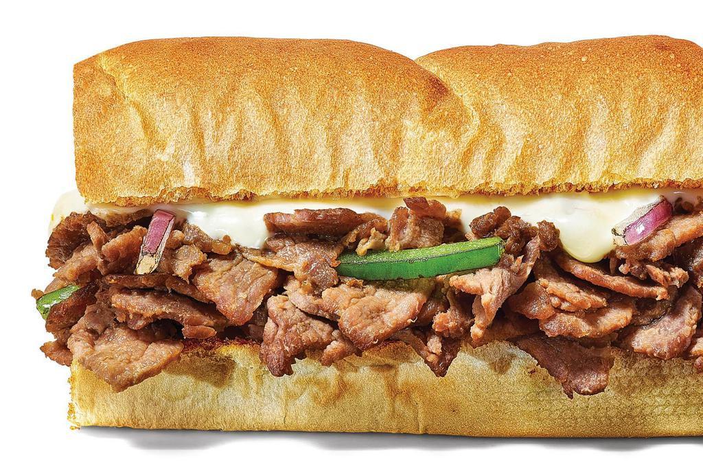 Steak & Cheese Footlong Regular Sub · Our Steak & Cheese sandwich is where warm, delicious steak gets topped with melty cheesiness. Get crazy with veggies and sauces to make it what you want.