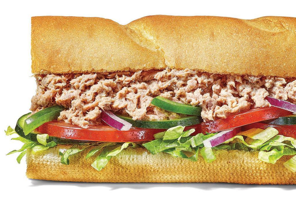 Tuna 6 Inch Regular Sub · You’ll love every bite of our classic tuna sandwich. 100% wild caught tuna blended with creamy mayo then topped with your choice of crisp, fresh veggies. 100% delicious..