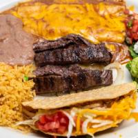 Katy Combo · Chef Recommendation. One cheese enchilada, one ground beef crispy taco, and 3oz. of your cho...