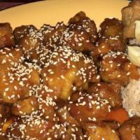 Sesame Chicken · Marinated lightly fried chicken, covered in a spicy sauce and topped with sesame seeds.
