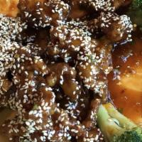 Sesame Beef · Marinated lightly fried beef, covered in a spicy sauce and topped with sesame seeds.