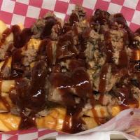 Brisket Fries · Queso cheese, brisket topped with bbq sauce.