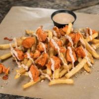 Native Buffalo Fries · Our signature seasoned fries topped with chopped chicken strippers tossed in our medium wing...