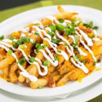 Loaded Fries · Large portion of our signature seasoned fries with cheddar jack cheese, bacon, sour cream, a...