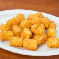 Tater Tots · Seasoned tater tots with just ketchup, queso, and honey BBQ sides.