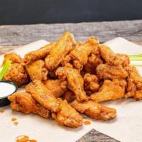 50 Pack Traditional Wings · Our traditional wings are lightly breaded and cooked to perfection then tossed in your favor...
