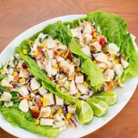 Chicken Lettuce Wraps · A crisp combination of grilled chicken, cabbage, carrots, bell peppers, tomatoes, red onion,...