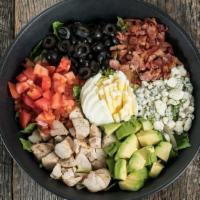 Cobb Salad · A tower of fresh greens topped with grilled diced chicken, crumbled bleu cheese, bacon, egg,...