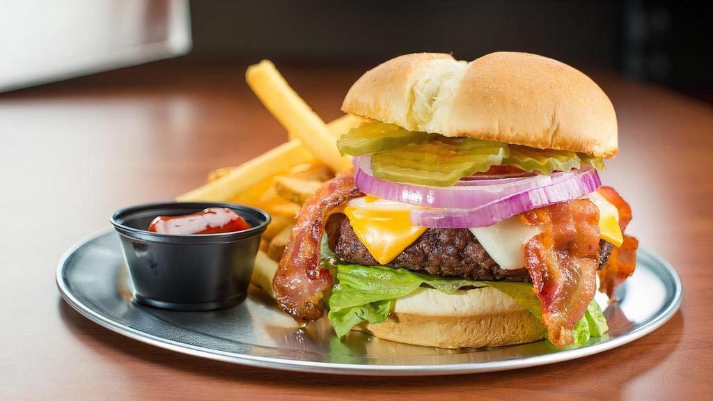 Bacon Cheeseburger* · Loaded with mozzarella cheese, cheddar cheese, hardwood smoked bacon, lettuce, tomato, onion, and pickles.