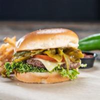 Green Chile Burger* · Roasted Anaheim chiles piled on top of melted pepper-jack cheese, tomato, lettuce, garlic bu...
