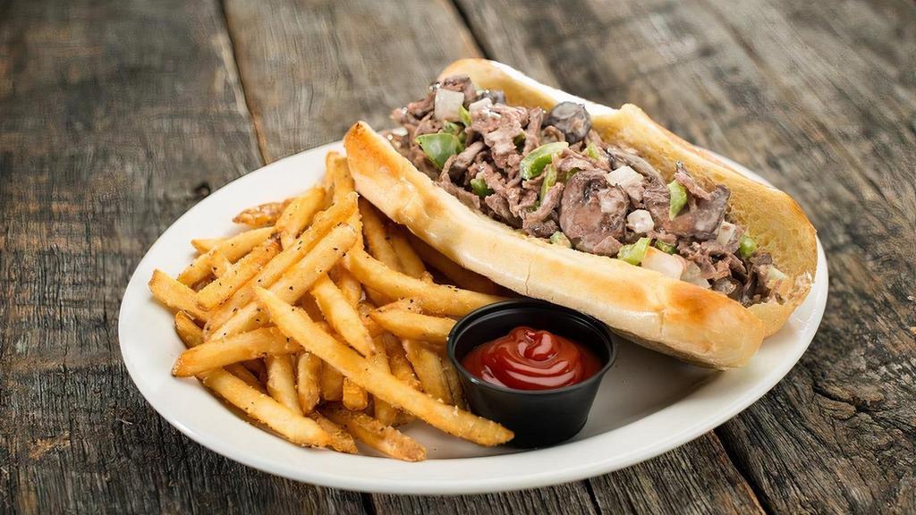 Philly Steak · Thinly sliced rib-eye steak grilled with onions, green bell peppers, and red wine mushrooms. Topped with our signature queso and mayonnaise.