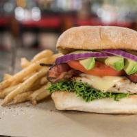 California Cluck · Charbroiled chicken breast on a toasted brioche bun topped with crisp bacon, sliced avocado,...