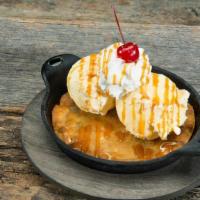 Native White Chocolate Macadamia Nut Cookie Sundae · Served with vanilla ice cream, whipped cream, caramel, and a cherry on top.