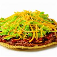Party Tostada · Fried corn tortilla, beans, chili sauce, lettuce, cheddar.