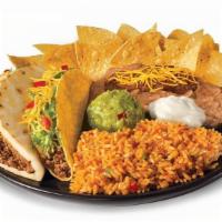 Beef Muchaco Platter · Beef Muchaco, Beef Taco (choice of crispy or soft), rice, beans, sour cream, guac, and a sma...