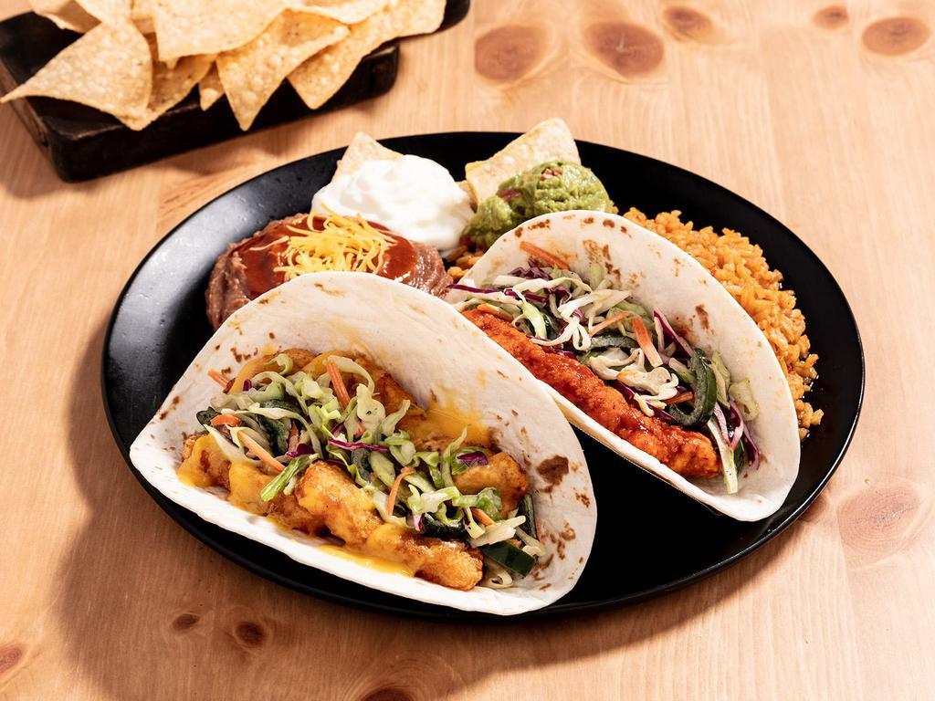 Chicken Taco Platter · Two Chicken Tacos (choice of crispy or soft), rice, beans, sour cream, guac, and a small bag of chips