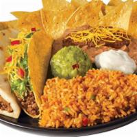 Chicken Muchaco Platter · Chicken Muchaco, Chicken Taco (choice of crispy or soft), rice, beans, sour cream, guac, and...