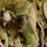 Tacos · Three tacos. Crispy corn, soft flour or corn tortillas; rice and beans served on the side.