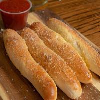 Large Bread Sticks · Our famous bread sticks topped with garlic butter and our parmesan romano cheese mix. Served...