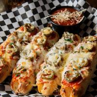 Small Pizza Sticks · Our famous bread sticks with jalapenos, pepperoni and extra cheese! Topped with garlic butte...