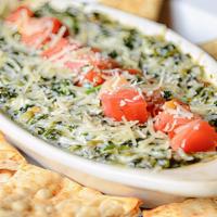 Spinach Dip · A creamy combination of cheeses, spinach, spice, and other secret ingredients that you won't...