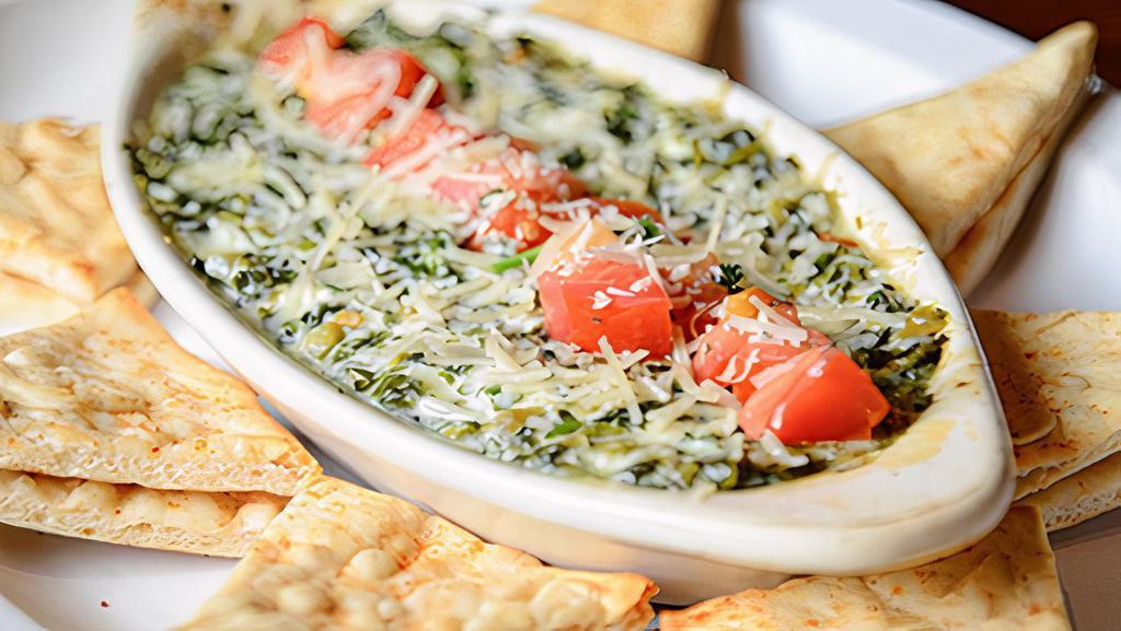 Spinach Dip · A creamy combination of cheeses, spinach, spice, and other secret ingredients that you won't be able to resist!