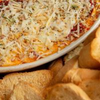 Lasagna Dip · Lasagna captured perfectly in each bite with layers of cheese, beef and Italian sausage. Smo...