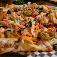 Large Chicken Nachos · A LARGE plate of corn chips piled with your favorites. Chicken, onions, tomatoes, black oliv...