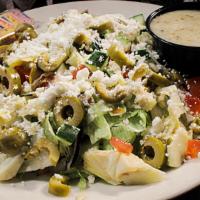 Large Mediterranean Salad · Crisp lettuce topped with tomatoes, feta, artichoke hearts, cucumbers, green olives, and a s...