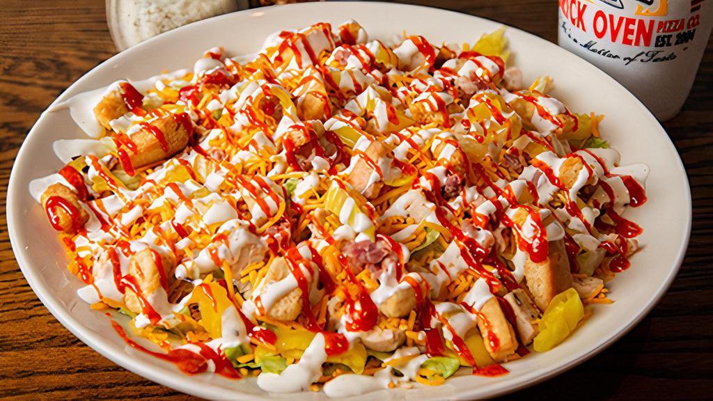 Small Sriracha Salad · Crisp lettuce, chicken, cheddar cheese, bacon, croutons and banana peppers. Drizzled with Sriracha sauce and Ranch dressing.