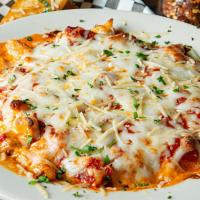 Chicken Spaghetti · Spaghetti noodles smothered with our signature cheese sauce, with a blend of cheeses and sea...