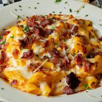Bacon Mac & Cheese · Penne noodles smothered in our creamy cheddar sauce topped with mozzarella and bacon. Cooked...